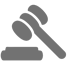 A gray icon of a gavel and block.